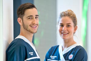 Two graduate nurses standing together