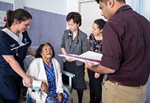 Patient being seen to by various health professionals